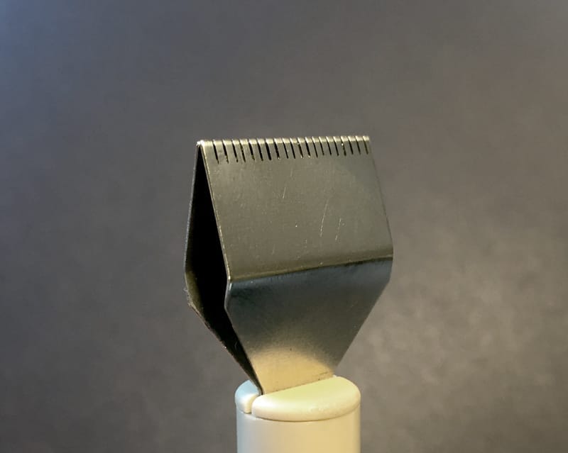 Write with the slotted side of the pen facing downward