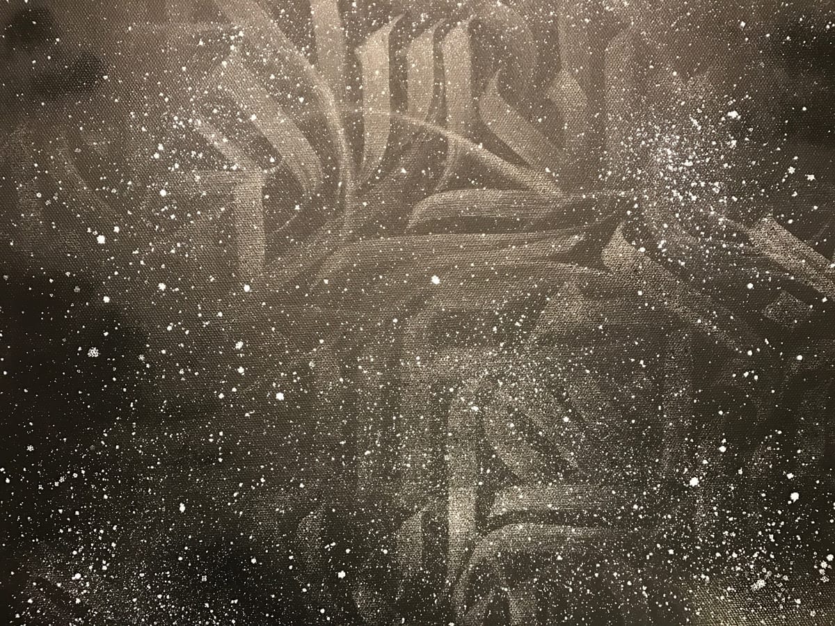white splatters on a black background
