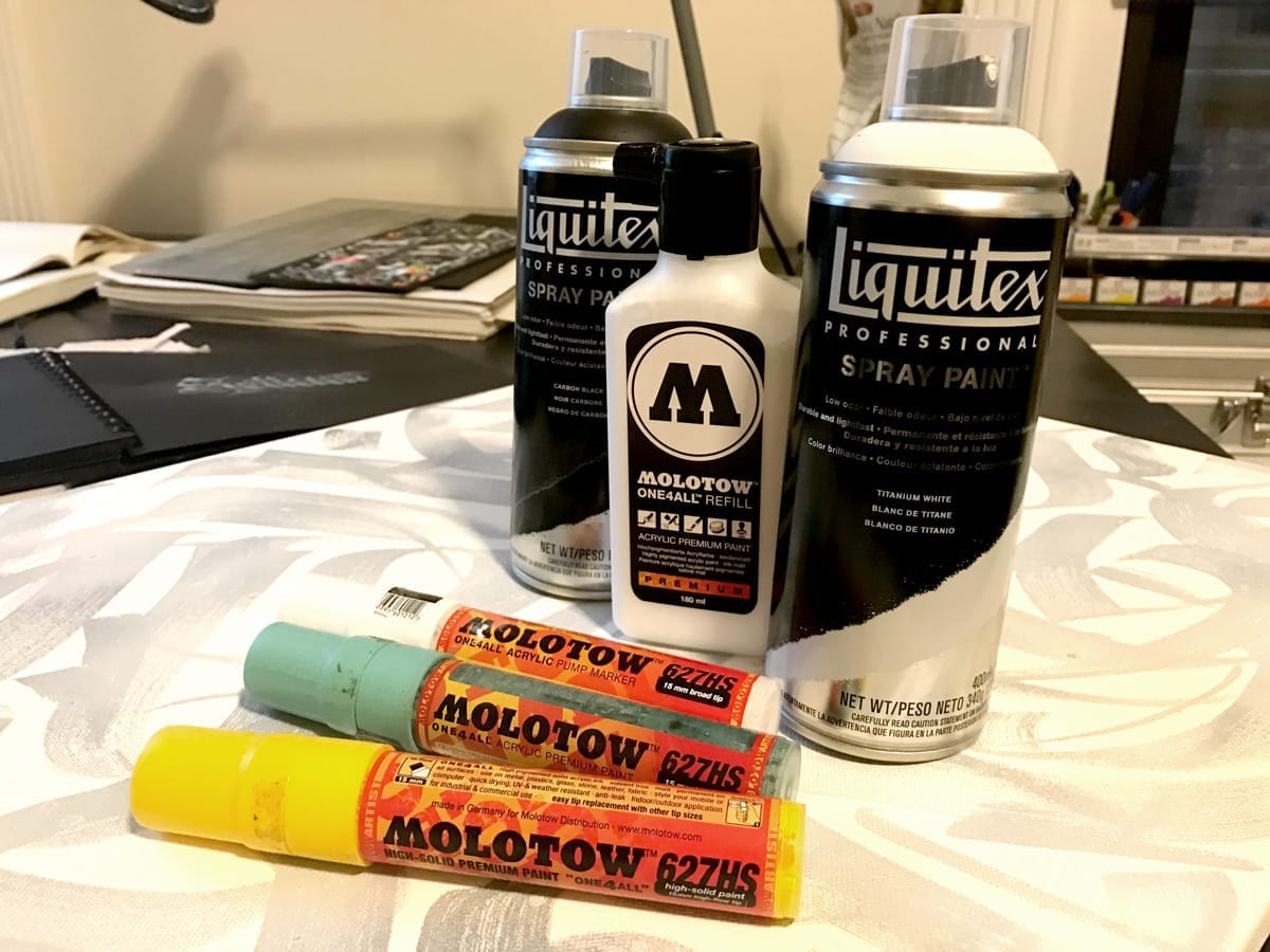 Spraypaint cans and markers